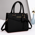 Luxurious Handbag with Bow and Sleek Gold Accents