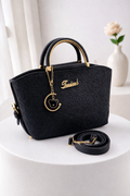 Versatile Handbag with Gold Details & Adjustable Strap