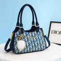 Classic Handbag with Decorative Charm